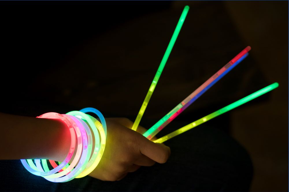 hand with holding glowsticks