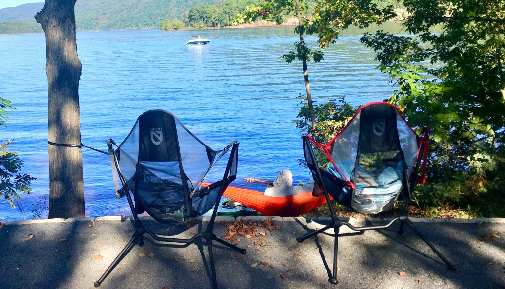 camp chairs by a lake